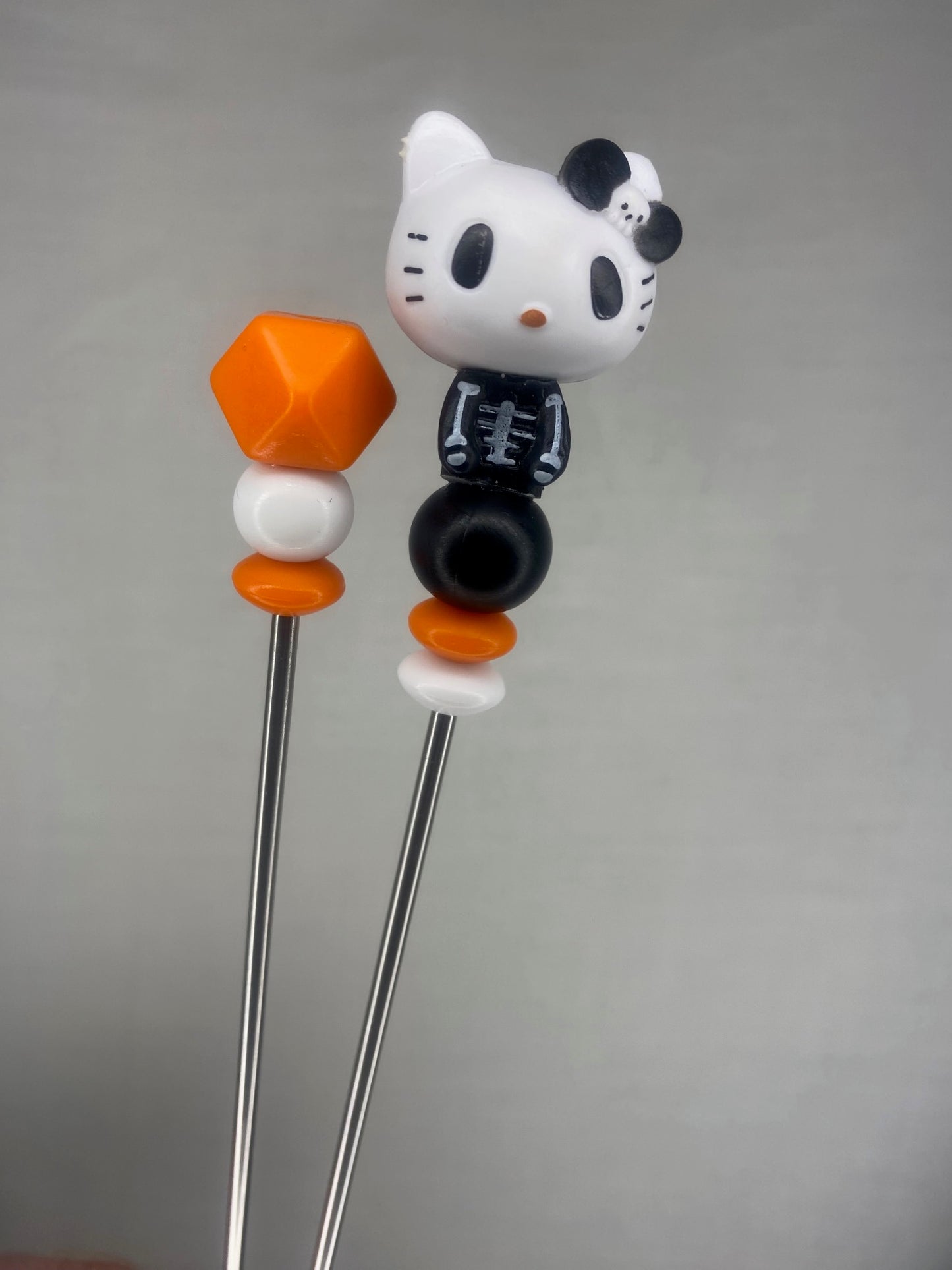 Hello kitty Skellington amigurumi sticks