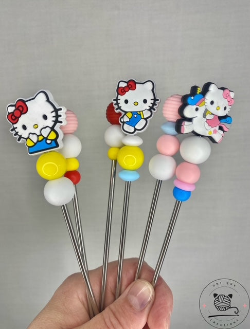 Pair of hello kitty mini amigurumi sticks
