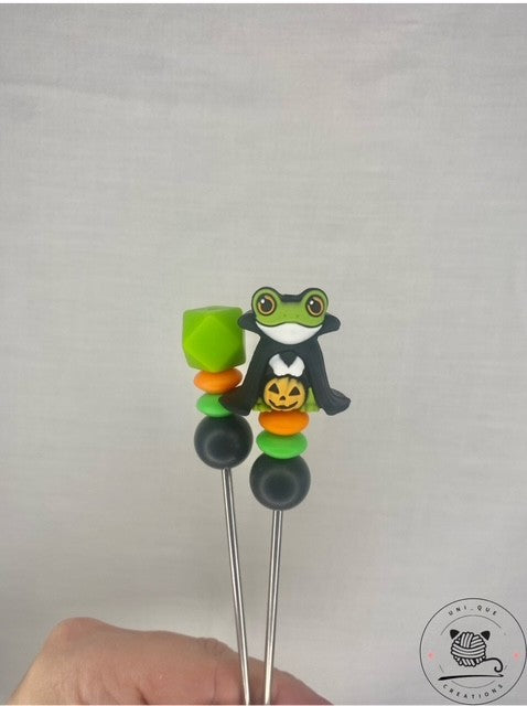 A pair of Count frogula Amigurumi sticks