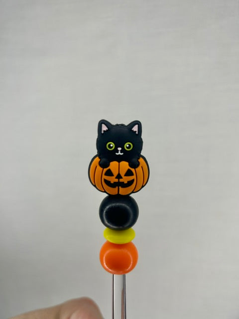 Cat in a pumpkin stuffing stick