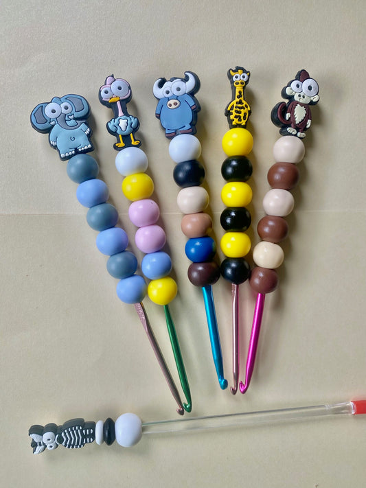 A Set of 5 animal custom beaded crochet hooks and stuffing stick