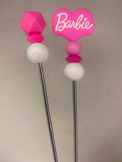 A pair of barbie amigurumi sticks