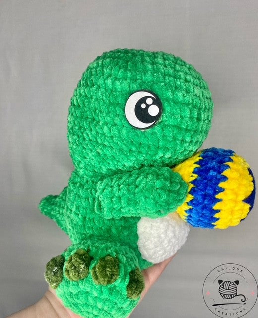 T rex  plushie hand made super soft crochet dinosaur holding a ball