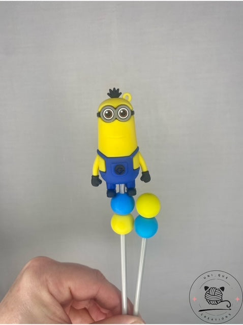 Pair of minion amigurumi sticks