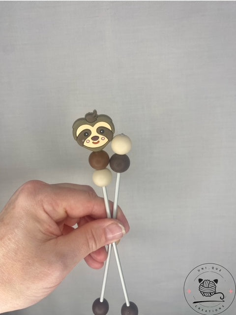 Pair of sloth mini amigurumi sticks