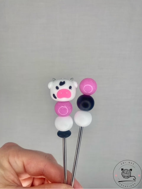 A Pair of cow  amigurumi sticks