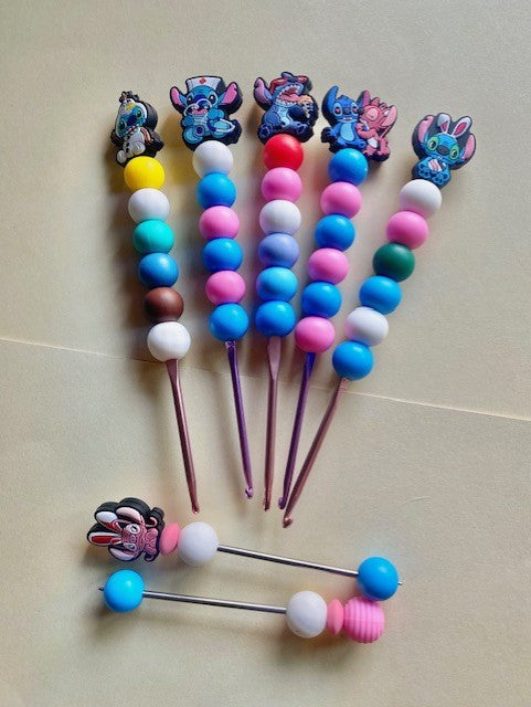 A Set of 5 stitch custom beaded crochet hooks and mini amigurumi sticks