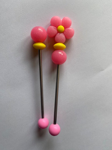 Pair of flower amigurumi sticks